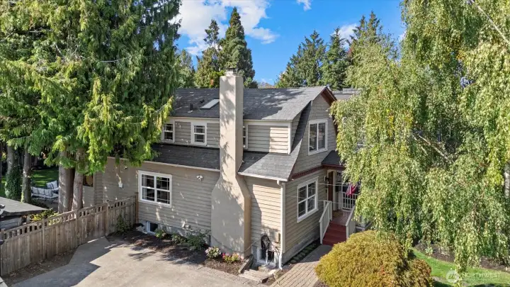 Home’s side view with spacious front and backyard