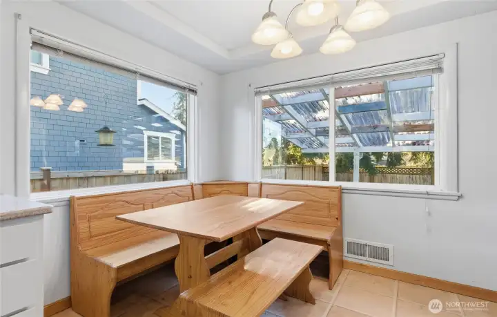 Nook in kitchen with view of backyard.