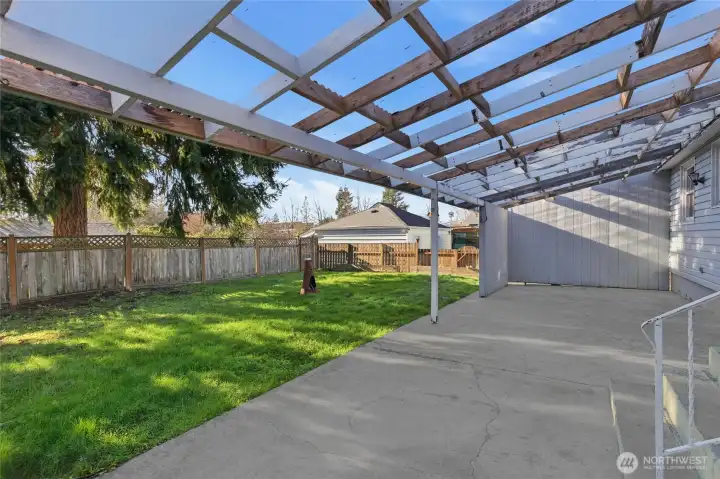 Spacious Covered Patio in Backyard.
