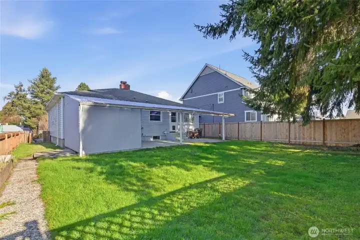 Fully Fenced Backyard. View from entrance of back alley.