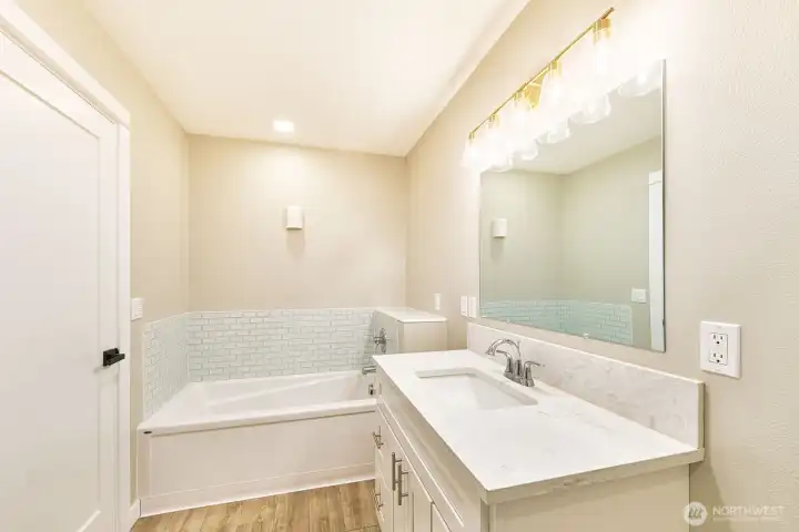 Light and bright with tiled tub