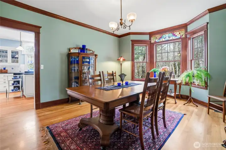 The formal dining room enjoys the same beautiful crown molding and millwork and is conveniently located steps away from the beautiful kitchen.