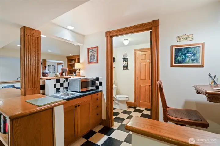 A lower-level wet bar and 3/4 bath.  There is so much storage in this home. It is amazing!