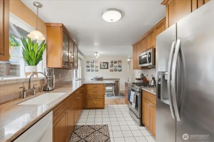 This updated galley style kitchen has beautiful sleek cabinetry for all your kitchen needs.