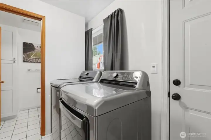 Laundry/mudroom has access door to back yard. Washer and dryer included in the sale of the home.
