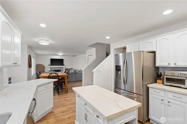 Kitchen with eat-in dining space opens to family room.