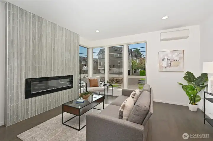 Custom floor-to-ceiling gas fireplace.