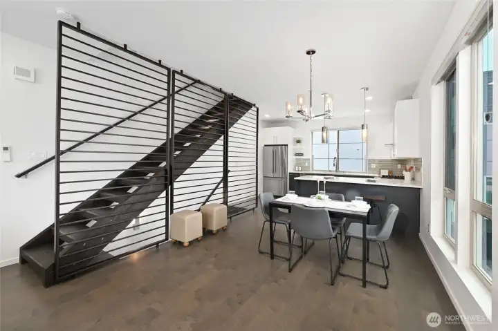 The open-concept living spaces are filled with natural light and showcase contemporary finishes throughout.