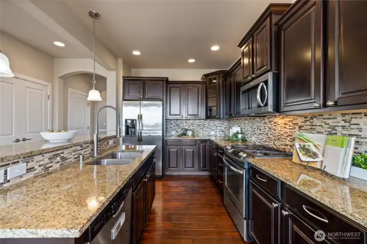 Granite countertops provide generous space for meal preparation