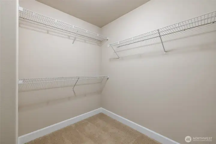 Large walk-in closet with generous storage spac