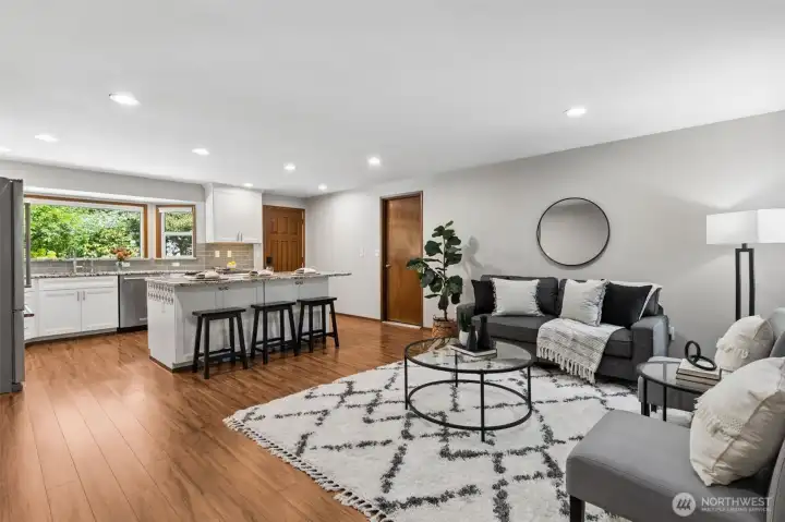 Open living room flows seamlessly into the updated kitchen.