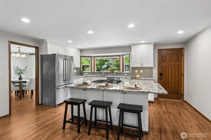 Spacious kitchen island with seating for up to five stools.