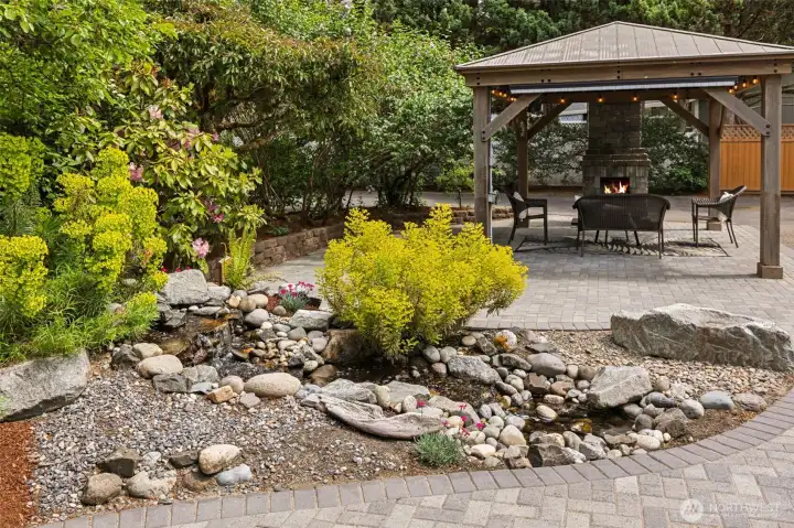 Updated pond feature (2023) with a sitting rock where you can relax and enjoy the sound of running water.