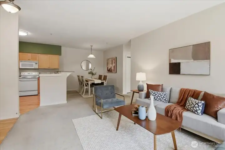 The open kitchen flows seamlessly into the dining and living areas