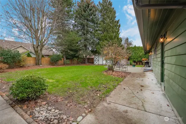 Fully fenced backyard and mature landscaping