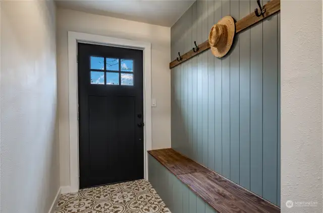 Entry with custom tile, bench with storage inside and coat rack