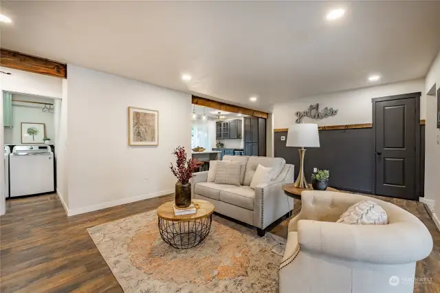 Living Room - Open to Kitchen/Dining with hall leading to Utility/Mudroom