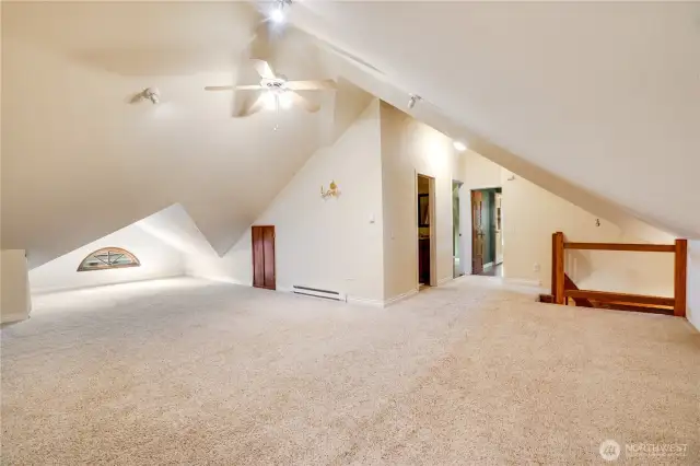 Midway down the 2nd floor hall a door opens to a shorter hall holding the upper staircase. This staircase leads you to the 3rd floor with its spacious, carpeted bonus room. Substantial storage under the eaves is easily accessible via a standard height door.