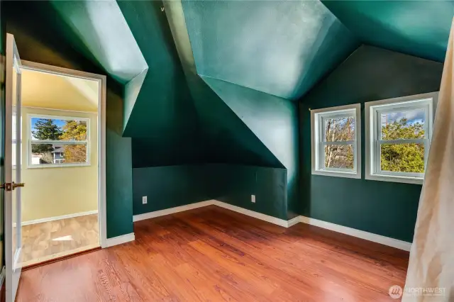 Along with its neighboring bedroom, this 7th bedroom adjoins a little bonus room, or sun porch that catches light from the south, west, and north.