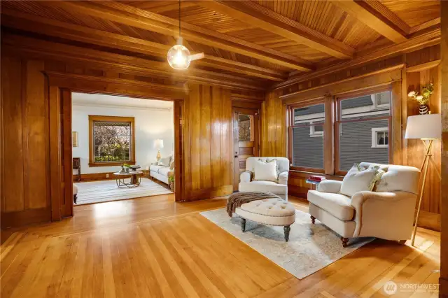 Easy movement between the dining room and living room provides for natural entertaining. There's always somewhere comfortable to sit and visit before and after a meal is served. Linger at the dining table, wander off for quiet chats in the parlor, bring games into the living room, play the piano by the fireside in the den. Notice the door in the corner of the living room that opens onto the wraparound porch for fresh air.