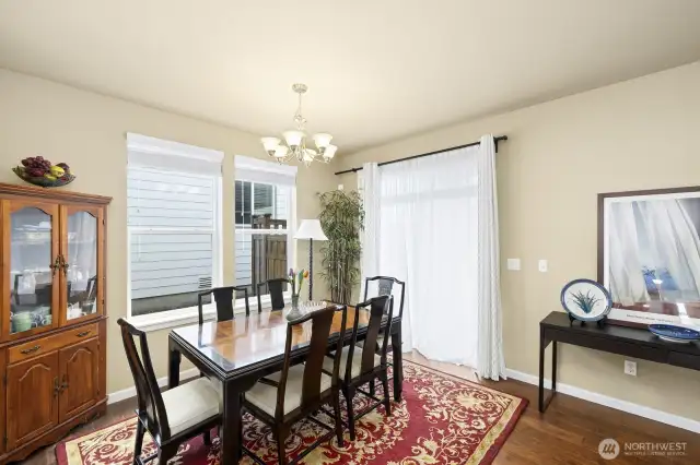 Elegant dining room next to a roomy space toward the kitchen.