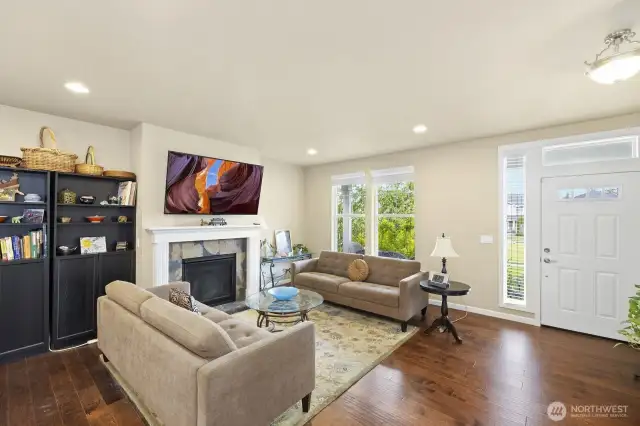 Spacious living room with gas fireplace.
