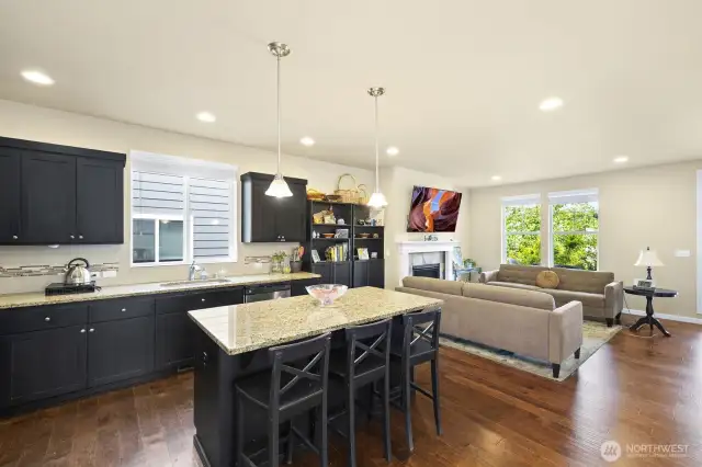 Elegant kitchen with granite island and work space countertops…
