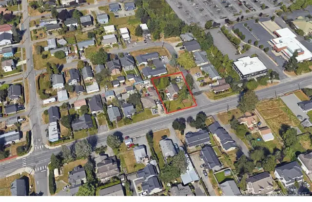 Convenient location close to shopping. Large lot shows development potential