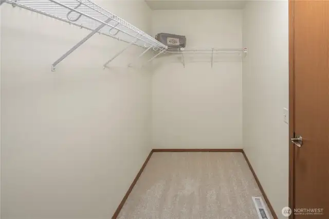 Primary large walk-in closet looking the other direction.