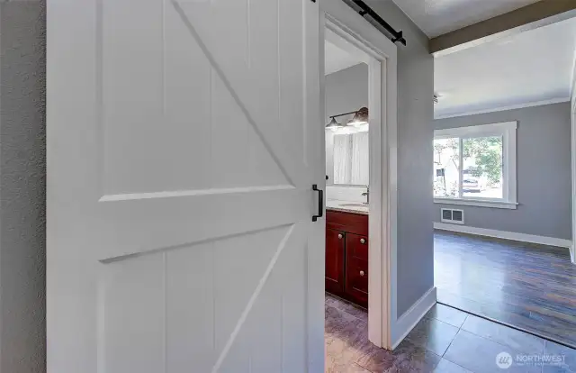 Updated barn door entry to bathroom