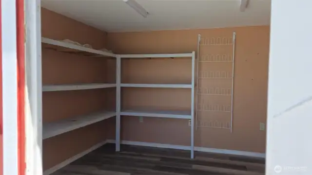 storage shelves inside red shed