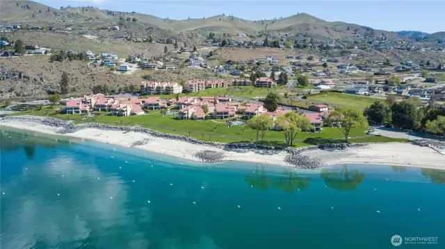 Rare opportunity to own a front row lakefront condo in Lake Chelan Shores steps from the beach and pristine waters of Washington’s premier vacation destination!