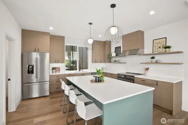Fully equipped kitchen with large island and walk-in pantry.
