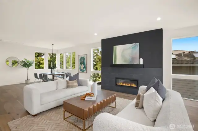 Spacious living room is centered around a fireplace.