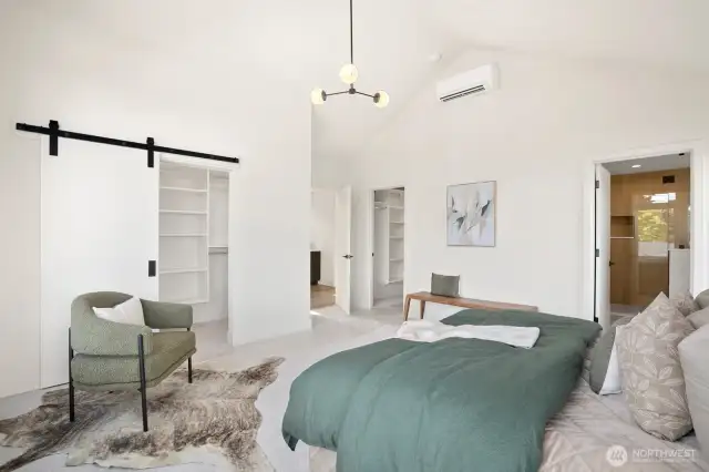 Primary suite is spacious with vaulted ceilings, dual closets and an en suite full bath with soaking tub.