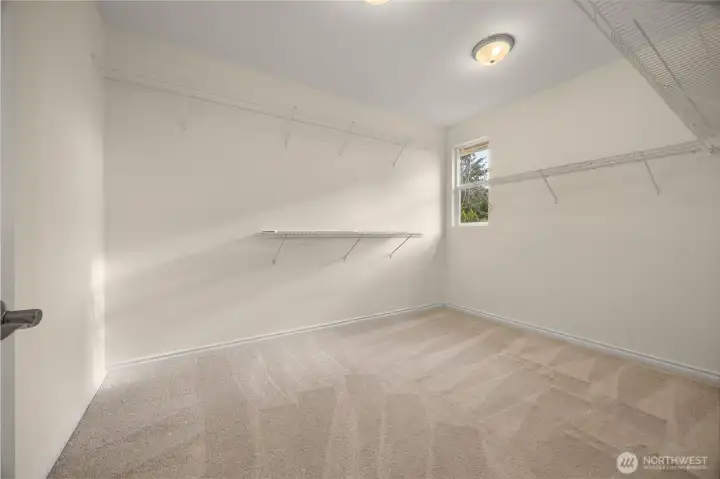 Huge primary bedroom walk in closet.