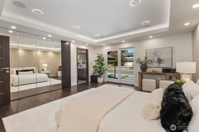 Wake up to light and space—with walk-in closet, tray ceiling, and private balcony access.