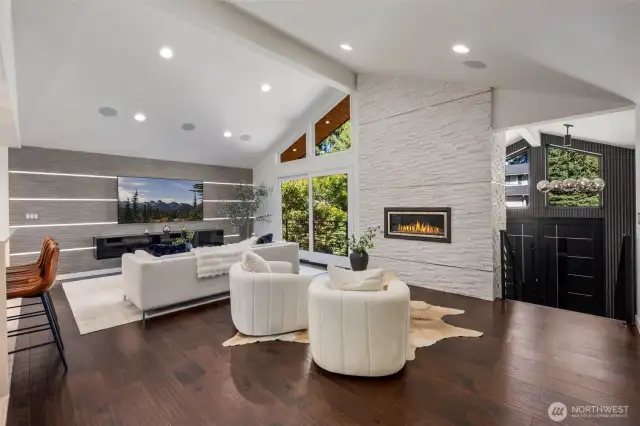 Stunning design, soaring ceilings, a sculptural fireplace set an unforgettable tone.
