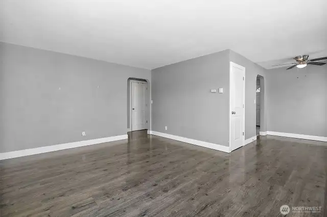 Living room with dining area to the right of the photo.