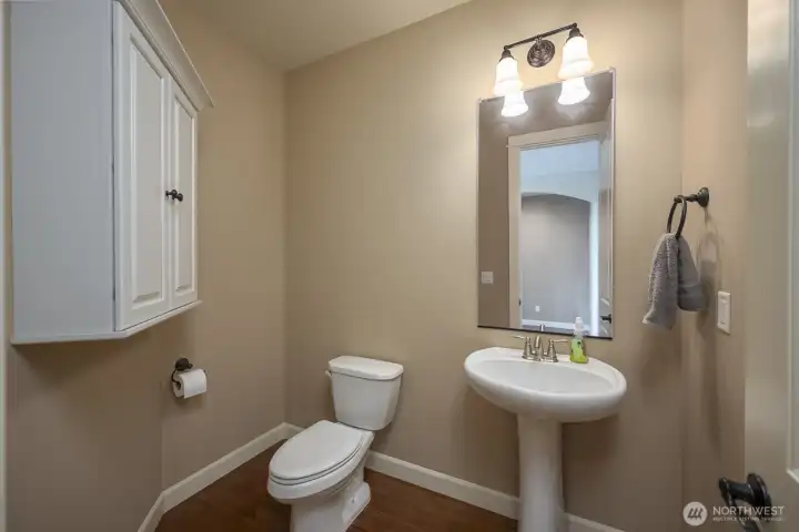 From the Formal Dining Room toward the Entry, Bedroom 1 entry on the immediate left, Primary Entrance to the right of Bedroom 2 and Guest Closet.
