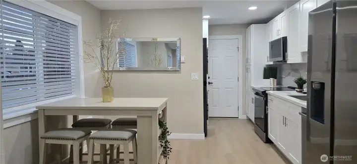 Main Home: Light-Filled Eating Area and Modern White Kitchen