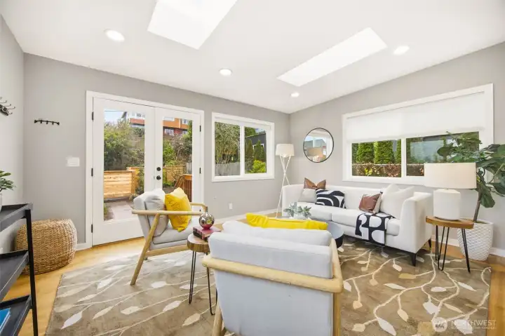 Light filled family room on east side of the home opens to a nicely landscaped back area with large patio.