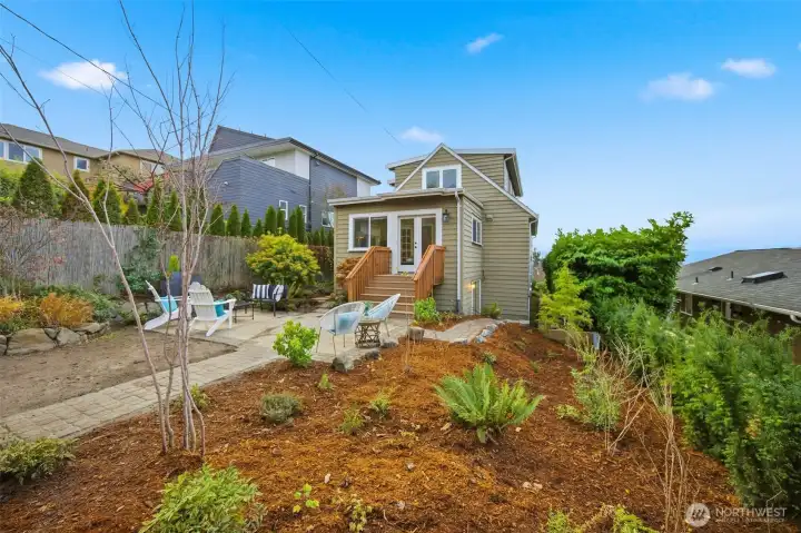 A structural retaining wall along back north property line was just completed and fresh landscaping completed that includes NW native plants and trees.  Established lawn should grow back in spring.