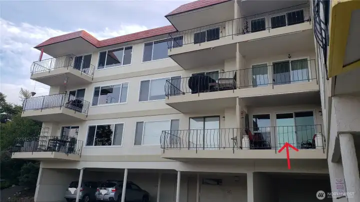 Reserved parking space 103 is just one space to the left below the red arrow.