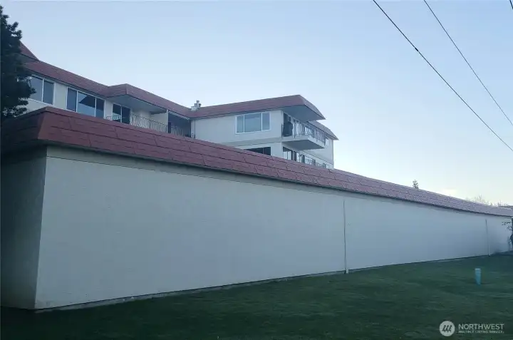 The green space behind garages is just above South Bay Trail.