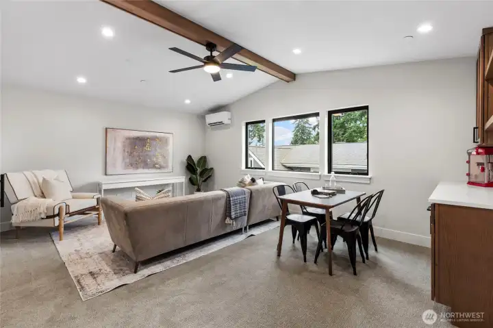 This entertainment room with a built-in bar offers the perfect setting for hosting and relaxing, blending casual comfort with modern style. The open layout, warm lighting, and multifunctional design make it ideal for gatherings, game nights, or unwinding with a drink in hand.