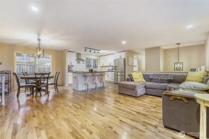 Open concept remodeled kitchen with island, stainless steel appliance, granite countertops. Lots of natural light.