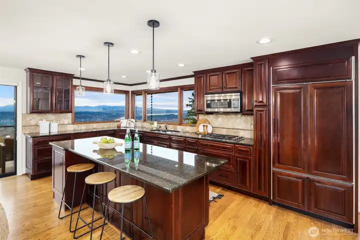 A beautiful kitchen including high-end appliances, upgraded cabinetry and room for everyone.