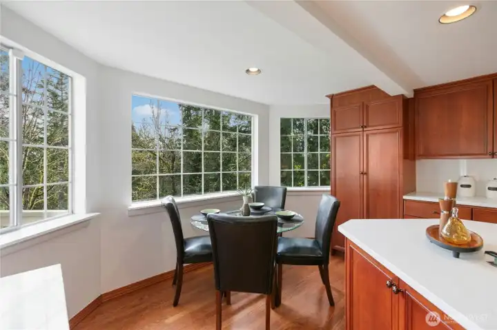 A breakfast nook looking out toward the trees is a great place to start your day.