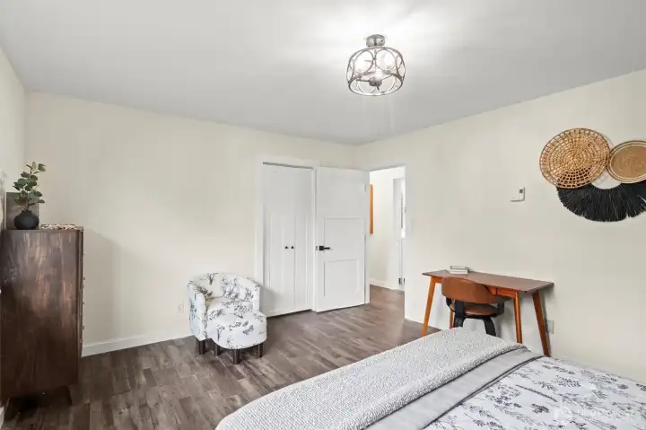 Another view of the Primary bedroom towards walk-in closet and doorway to hall.